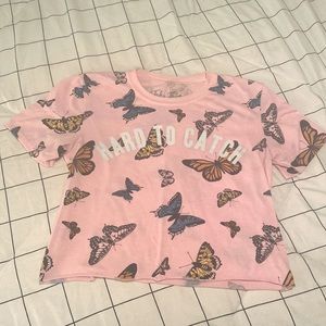 Pink cropped butterfly shirt.